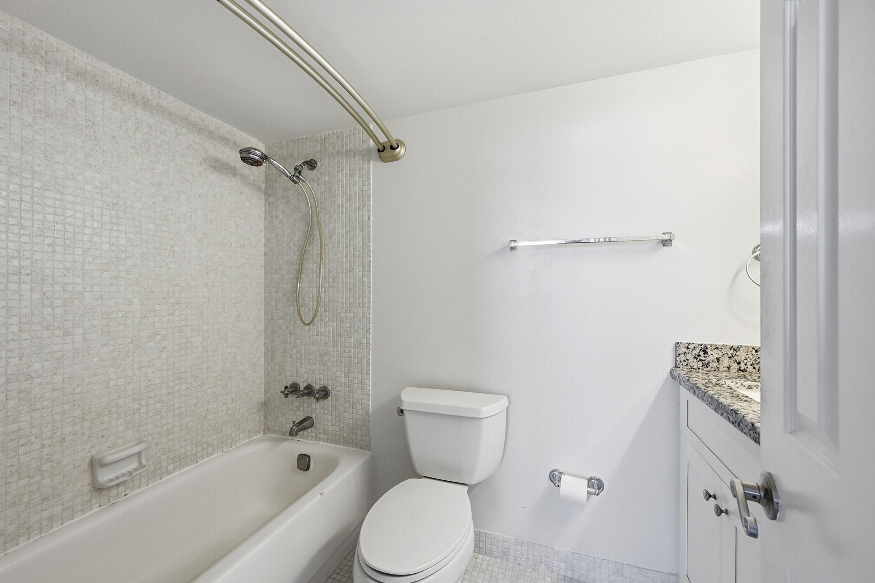 5700 Northwest 2nd Avenue, Unit 604 Boca Raton, FL 33487 - Photo 13 of 43 a bathroom with a toilet sink and shower
