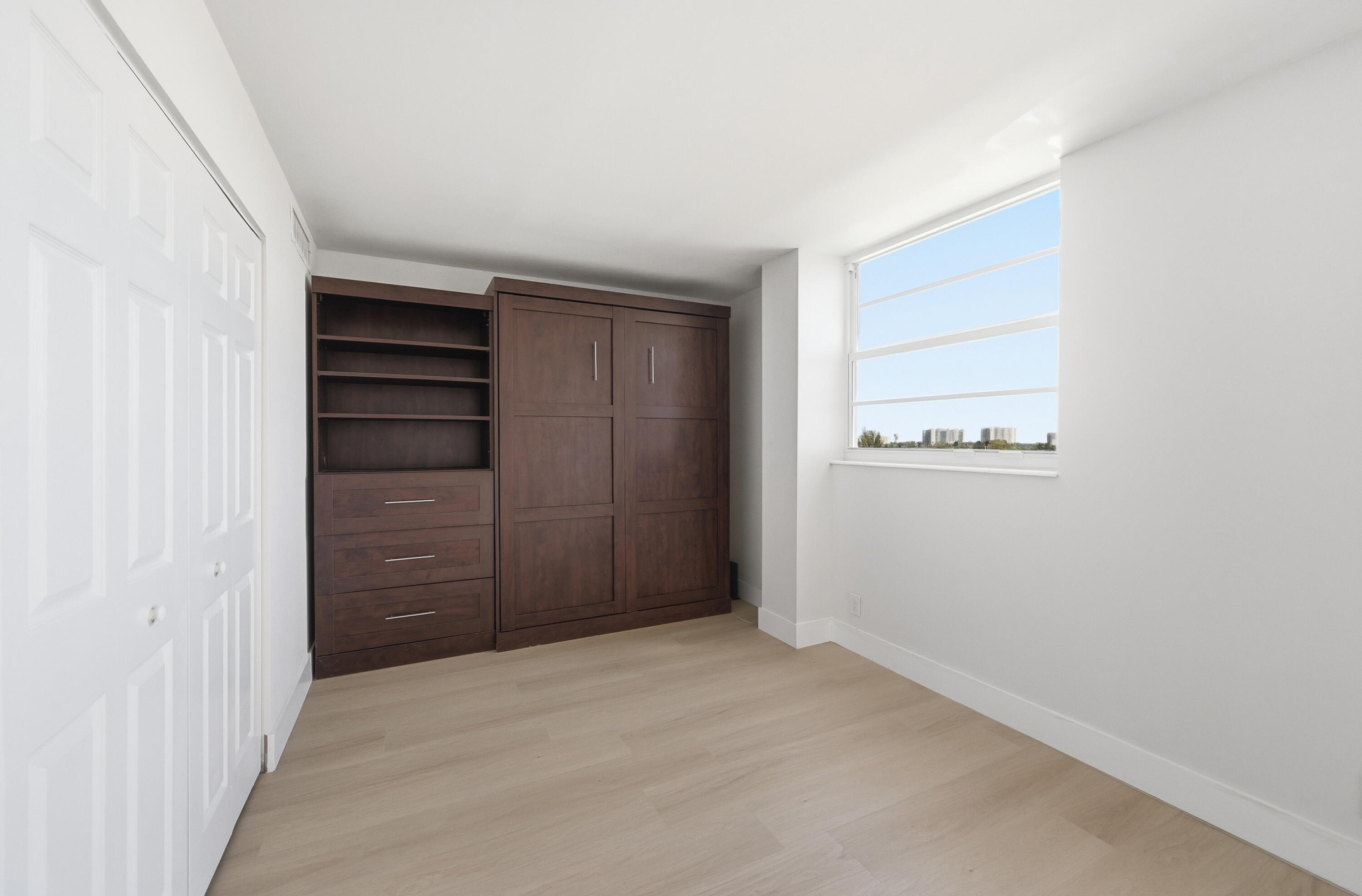 5700 Northwest 2nd Avenue, Unit 604 Boca Raton, FL 33487 - Photo 17 of 43 an empty room with closet