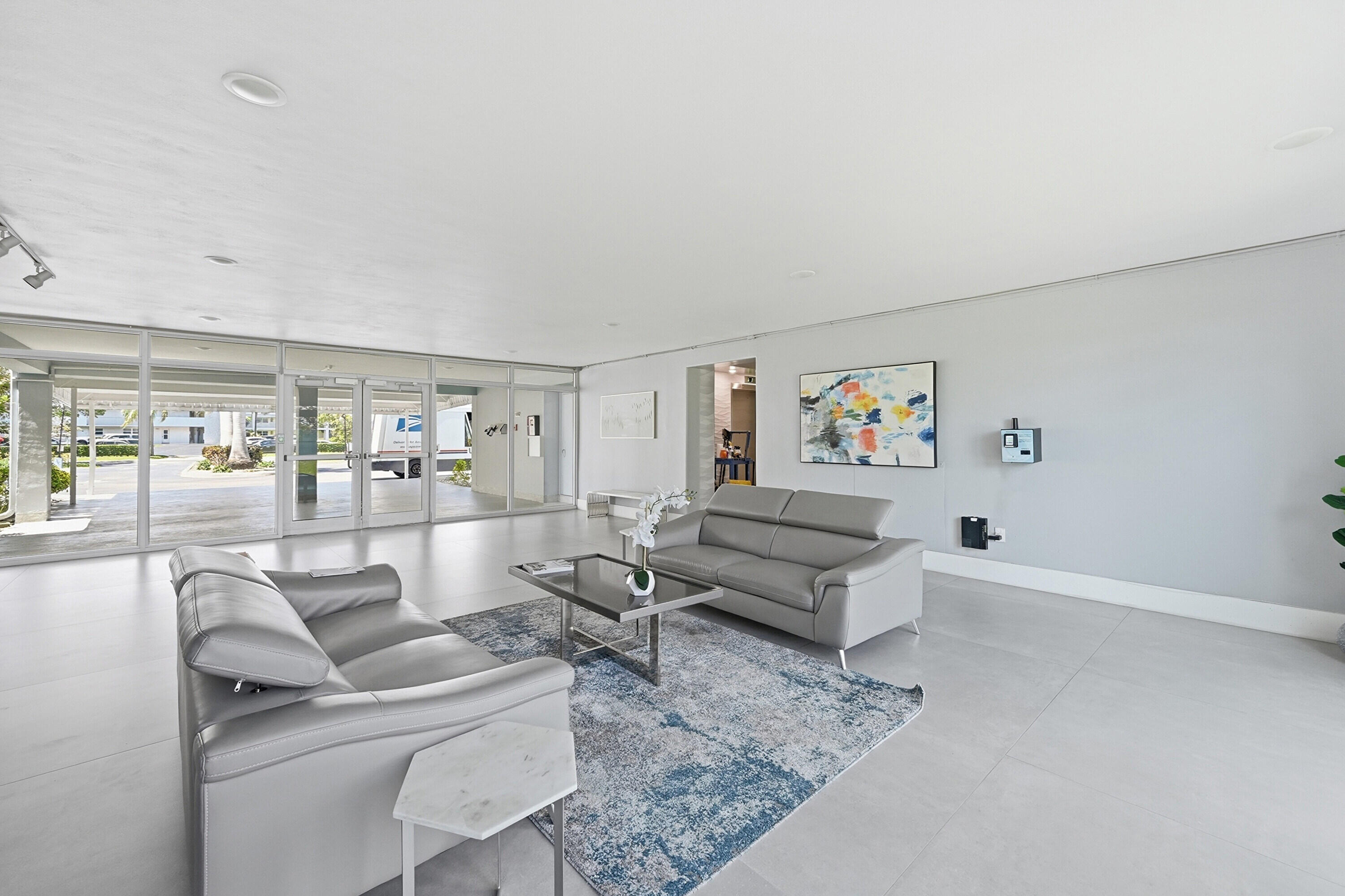 5700 Northwest 2nd Avenue, Unit 604 Boca Raton, FL 33487 - Photo 20 of 43 a living room with furniture and wooden floor