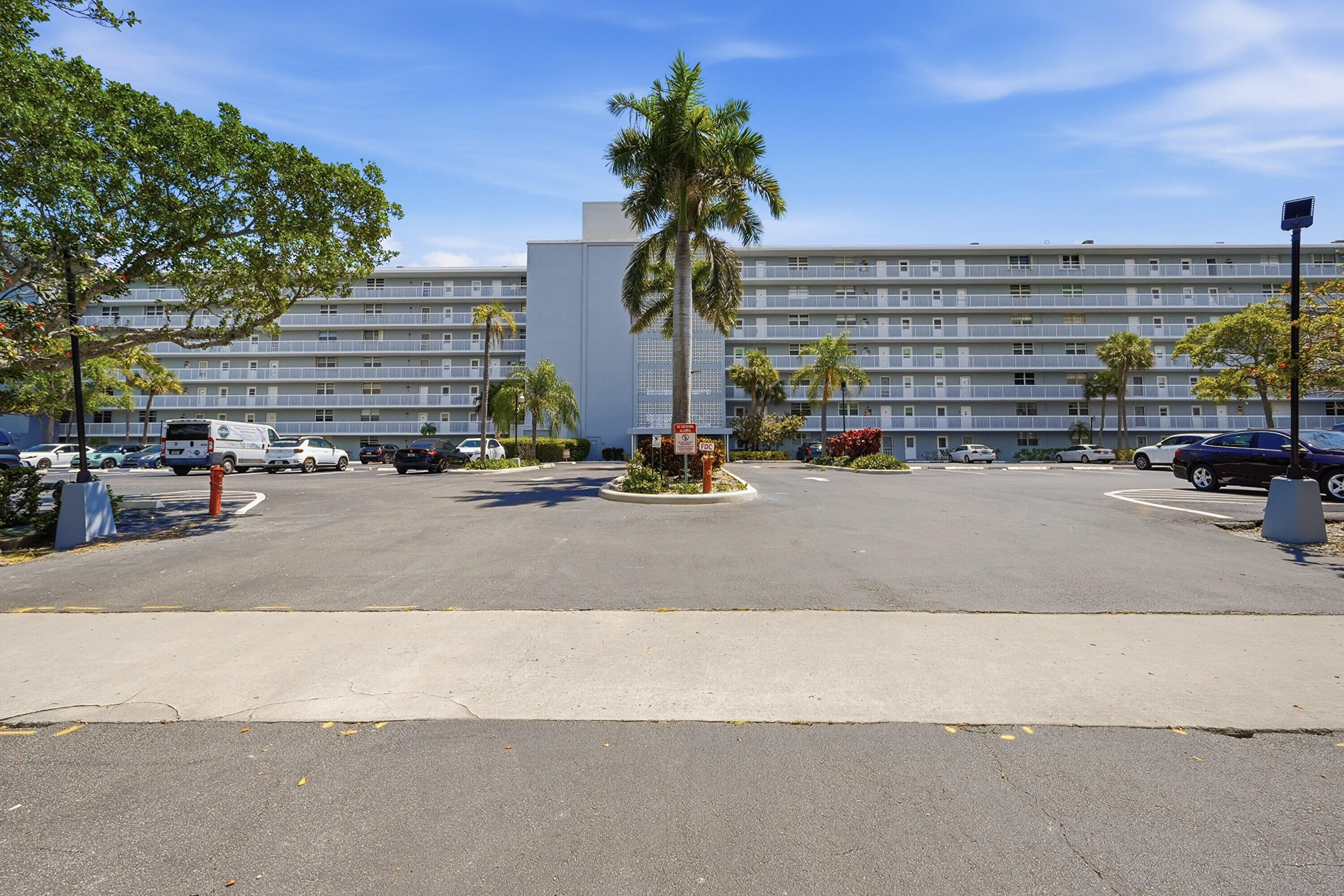 5700 Northwest 2nd Avenue, Unit 604 Boca Raton, FL 33487 - Photo 25 of 43 a view of building with cars