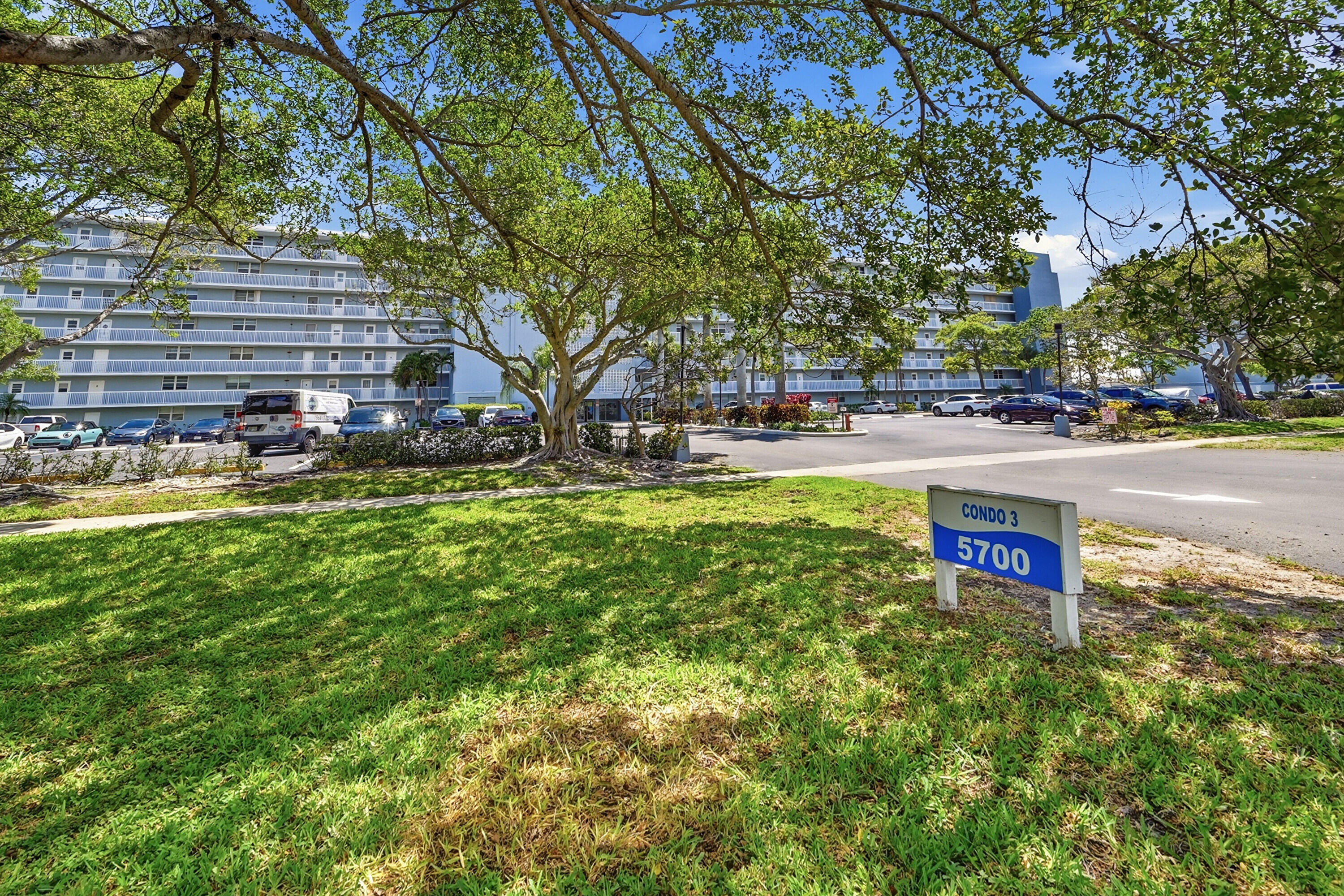 5700 Northwest 2nd Avenue, Unit 604 Boca Raton, FL 33487 - Photo 27 of 43 a swimming pool with outdoor seating and yard