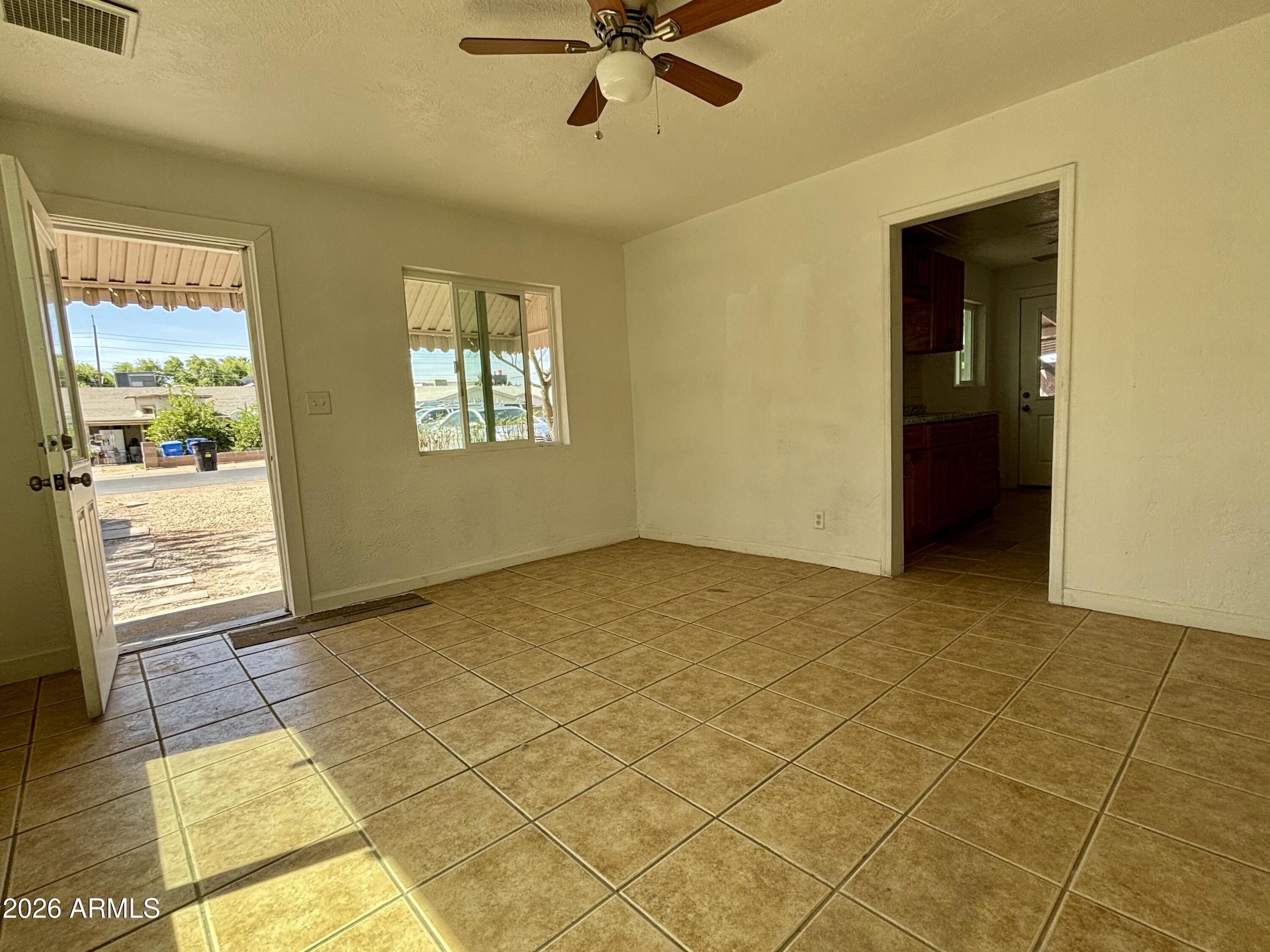 3036 West Almeria Road Phoenix, AZ 85009 - Photo 2 of 20 a view of an empty room