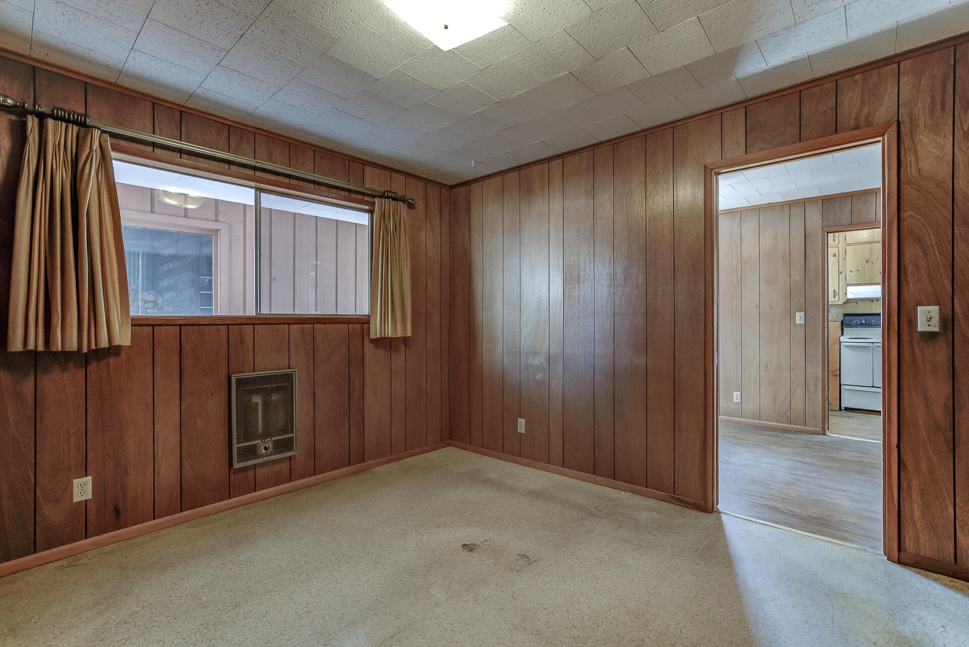 600 Cedar Street Mount Shasta, CA 96067 - Photo 15 of 26 a view of an empty room with a fireplace and a window