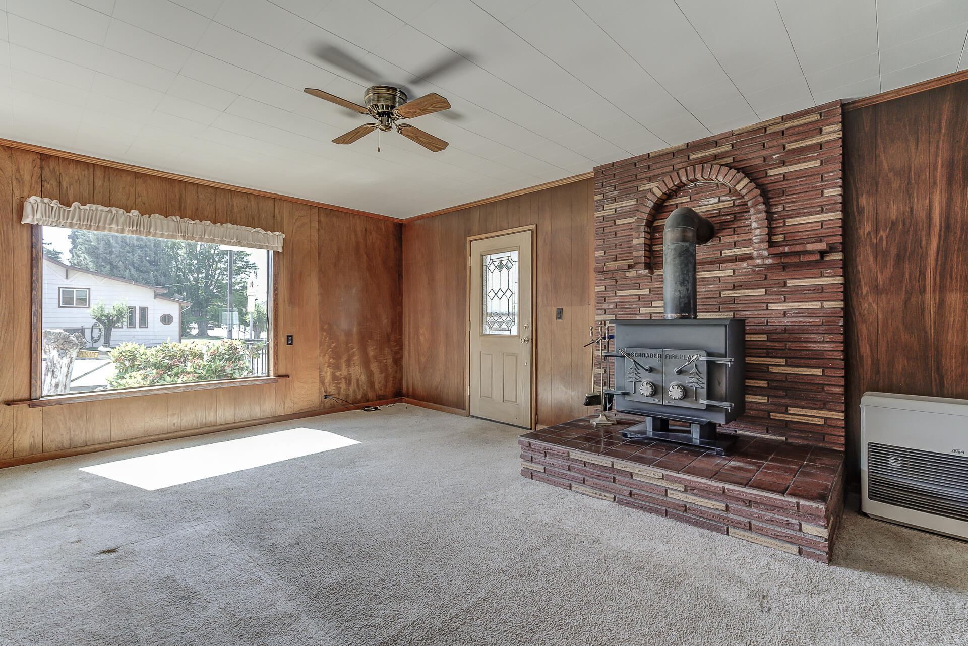600 Cedar Street Mount Shasta, CA 96067 - Photo 9 of 26 a living room with furniture and a fireplace