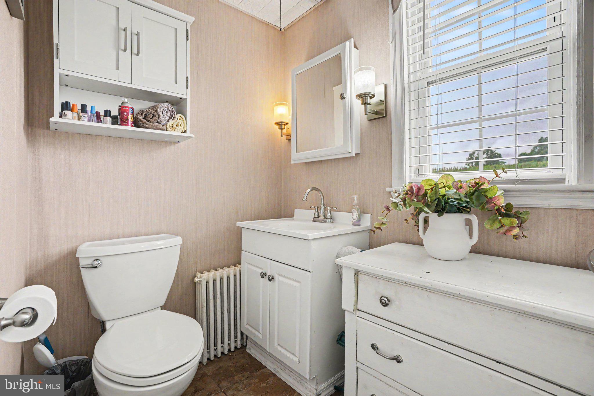 420 Carlisle Road Biglerville, PA 17307 - Photo 20 of 41 a bathroom with a granite countertop toilet sink and mirror