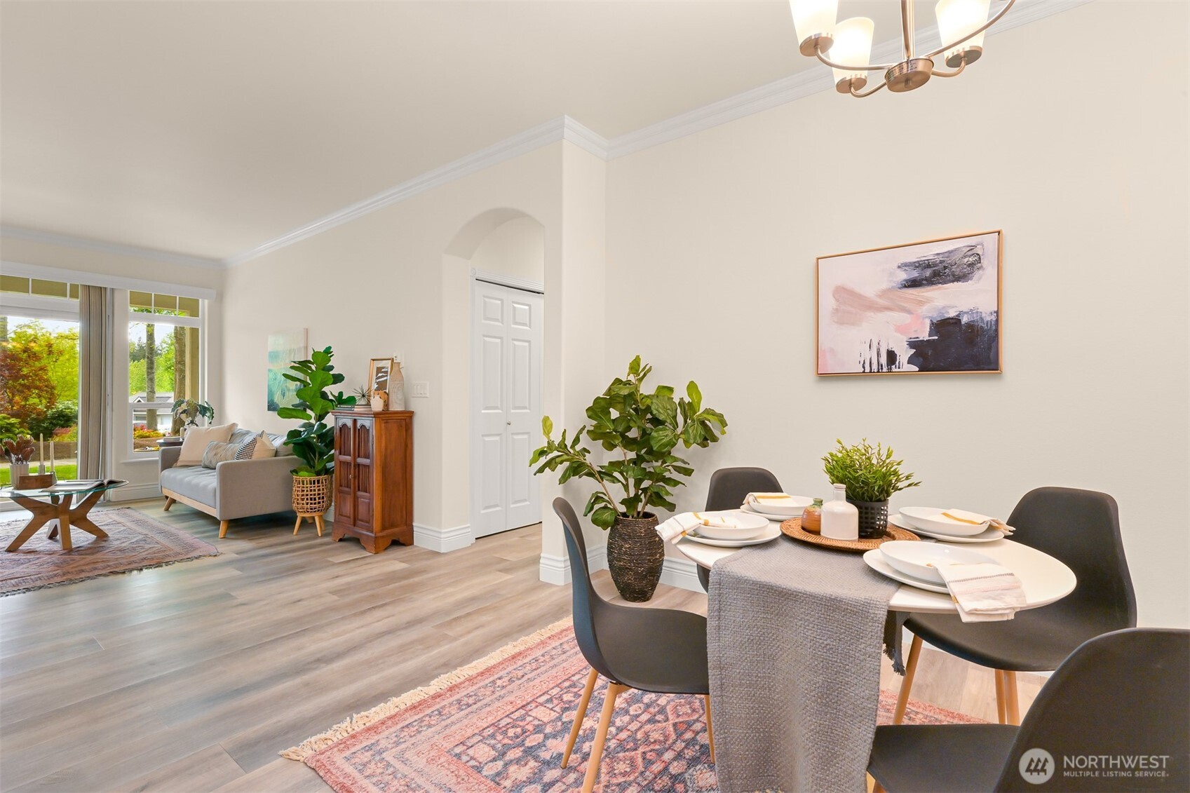 4579 El Dorado Way, Unit 107 Bellingham, WA 98226 - Photo 12 of 40 a dining room with furniture potted plants and wooden floor