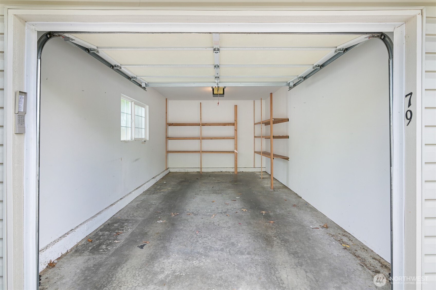 4579 El Dorado Way, Unit 107 Bellingham, WA 98226 - Photo 28 of 40 a view of a livingroom with a fireplace a window and stairs