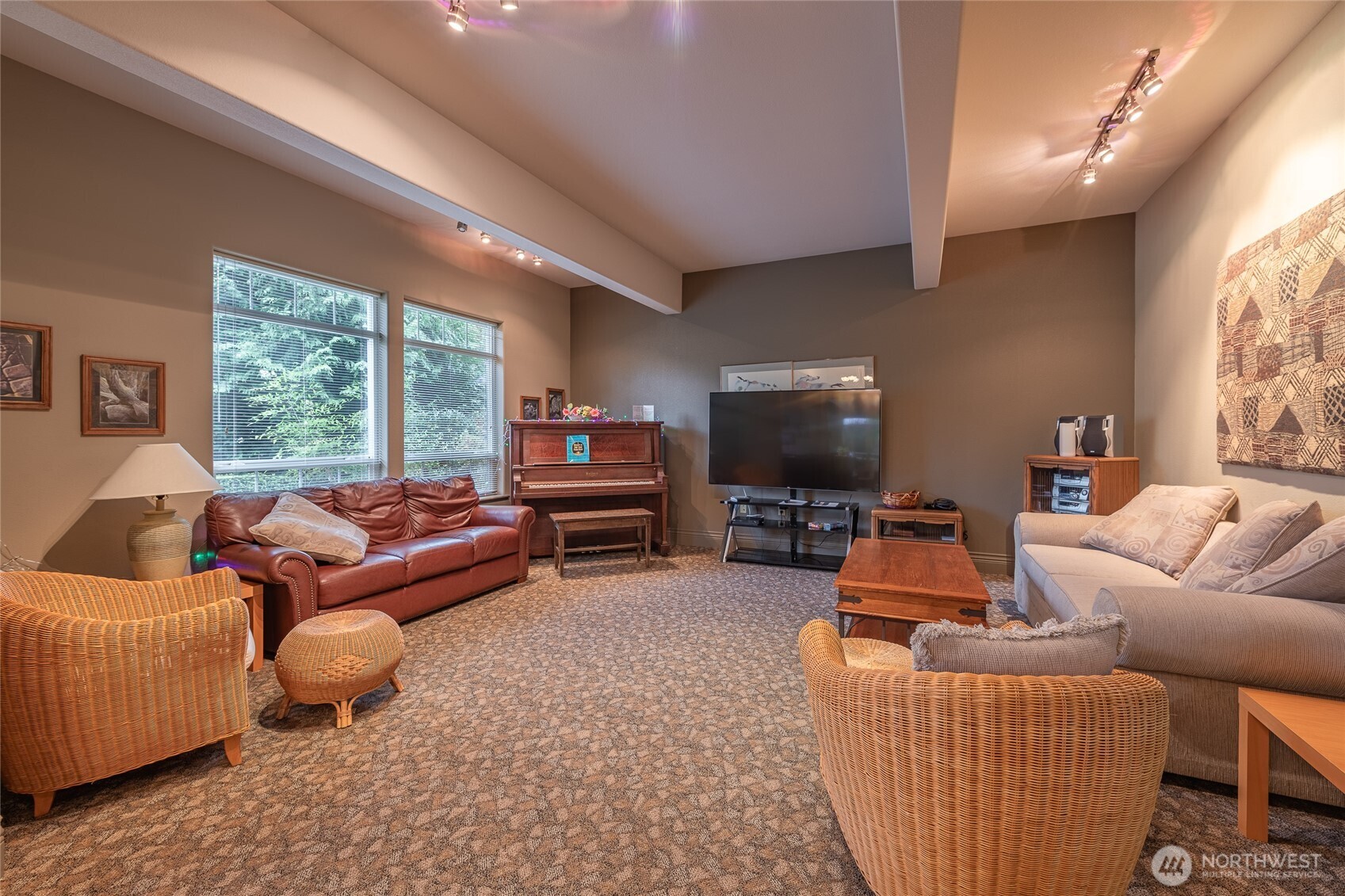4579 El Dorado Way, Unit 107 Bellingham, WA 98226 - Photo 30 of 40 a living room with furniture a large window and a flat screen tv