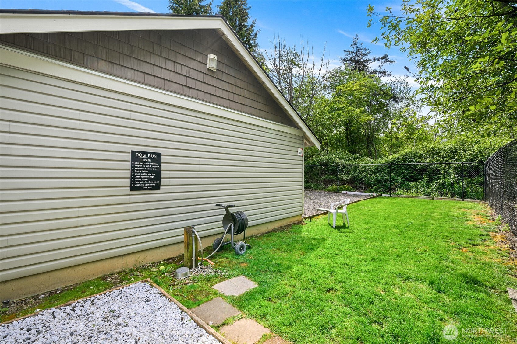 4579 El Dorado Way, Unit 107 Bellingham, WA 98226 - Photo 33 of 40 a backyard of a house with plants and tree