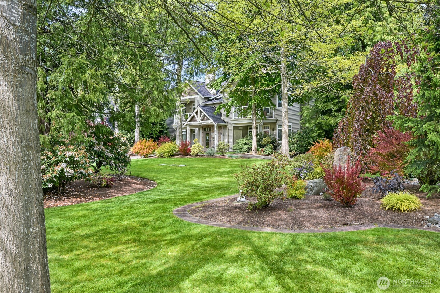 4579 El Dorado Way, Unit 107 Bellingham, WA 98226 - Photo 38 of 40 a view of a house with a yard and sitting area