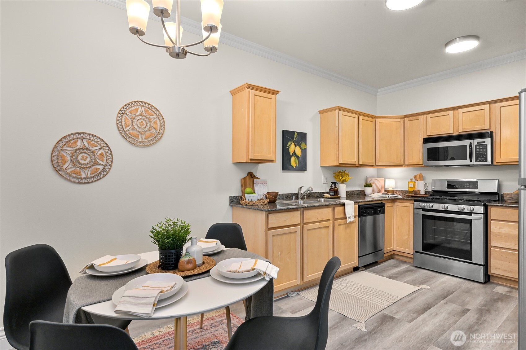 4579 El Dorado Way, Unit 107 Bellingham, WA 98226 - Photo 6 of 40 a kitchen with granite countertop a dining table and chairs