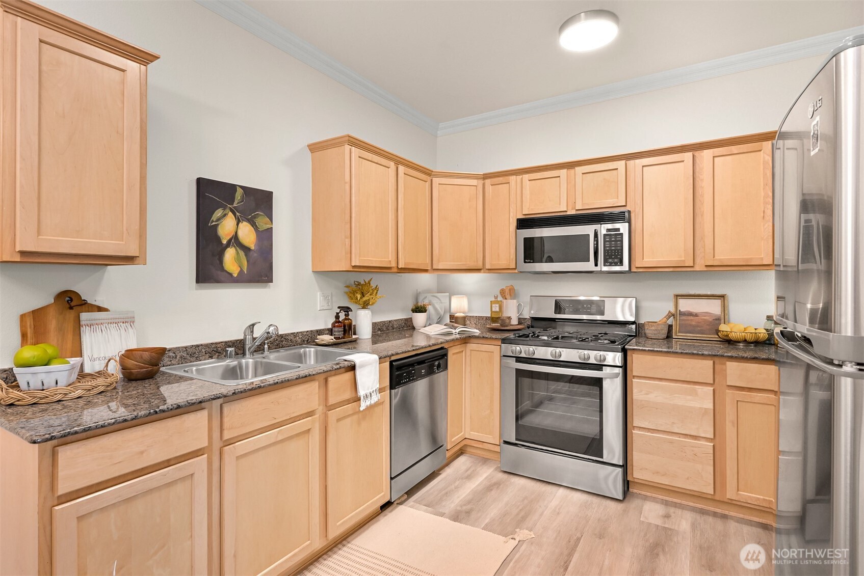 4579 El Dorado Way, Unit 107 Bellingham, WA 98226 - Photo 9 of 40 a kitchen with a sink stove and microwave