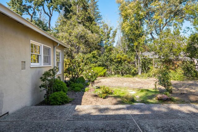 a kitchen with a sink stove and refrigerator