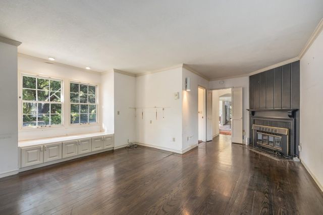 a bathroom with a glass shower door and a sink