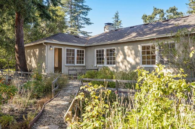 a bathroom with a sink a vanity and a large mirror