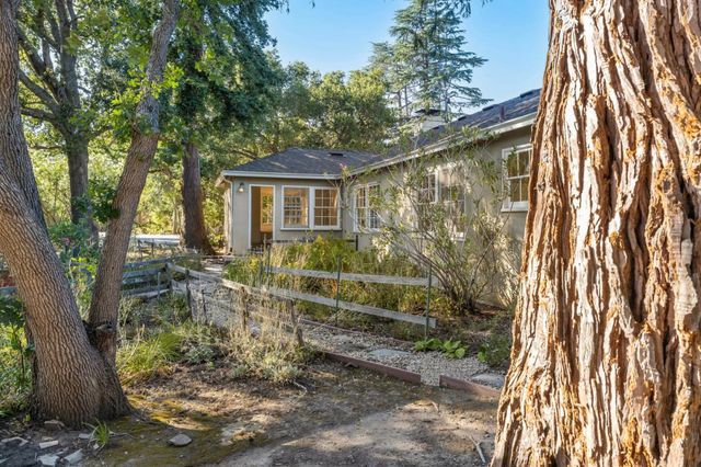 a view of a room with walk in closet with empty racks