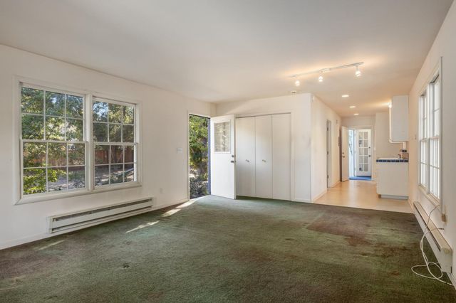 a view of empty room with wooden walls