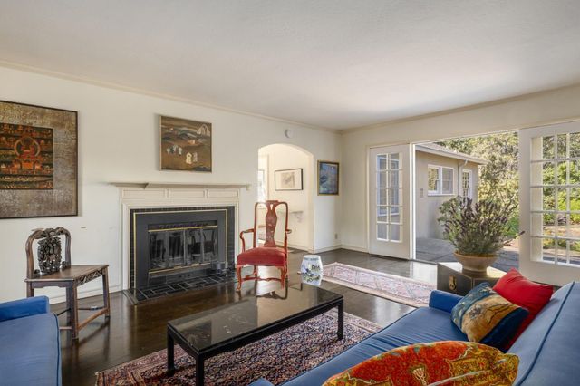 a yellow house with trees in front of it