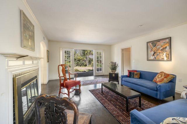 a view of a livingroom with furniture and window