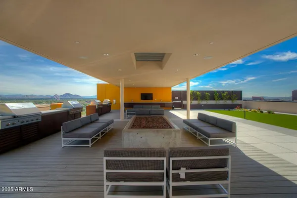 a view of a patio with table and chairs with wooden floor