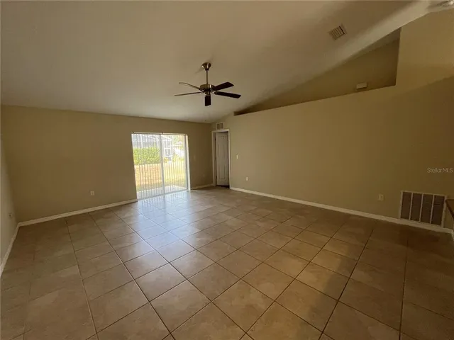 a view of an empty room with windows