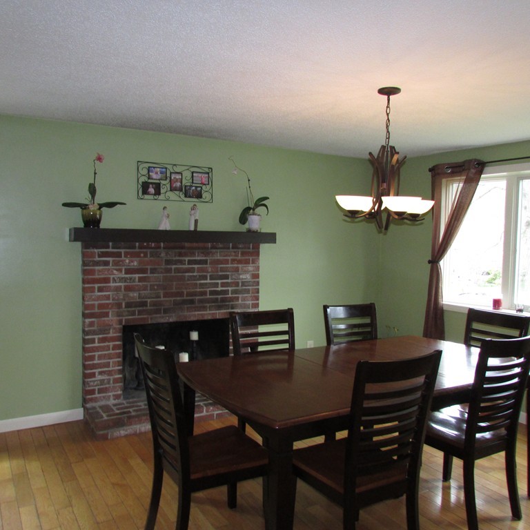 46 Edward Road Townsend, MA 01469 - Photo 6 of 23 a dining room with furniture a chandelier and wooden floor