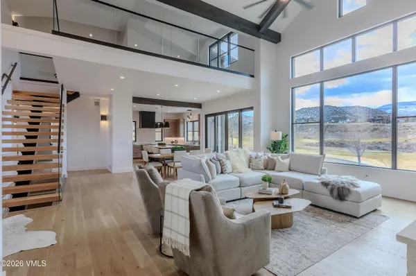 a kitchen with stainless steel appliances granite countertop a sink a stove and refrigerator