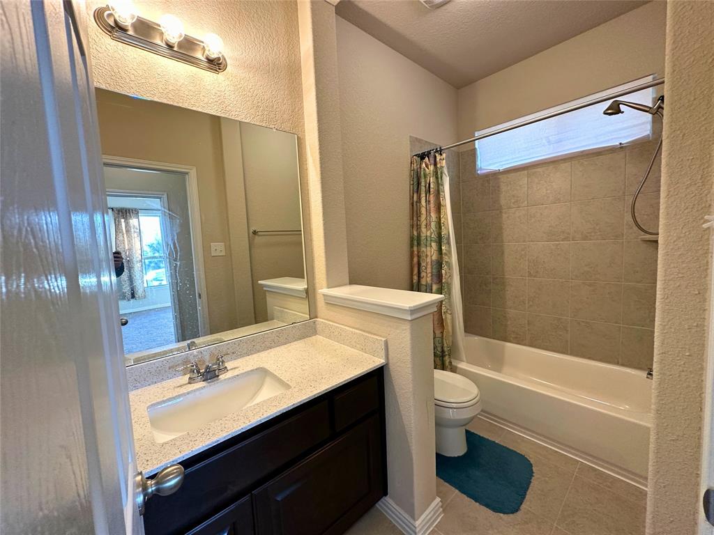 3117 Hidalgo Loop Round Rock, TX 78665 - Photo 6 of 27 a bathroom with a sink a toilet and shower