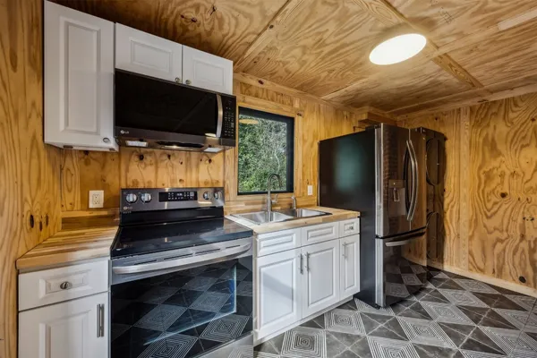a kitchen with a stove and a microwave