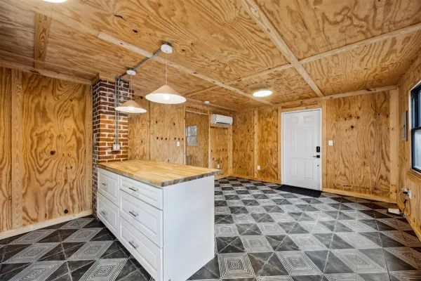 a bathroom with a granite countertop sink a toilet and shower