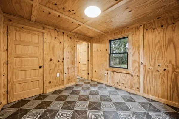 a view of a bathroom with a shower and a window