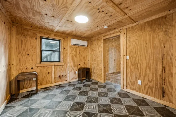 a view of a bedroom with windows