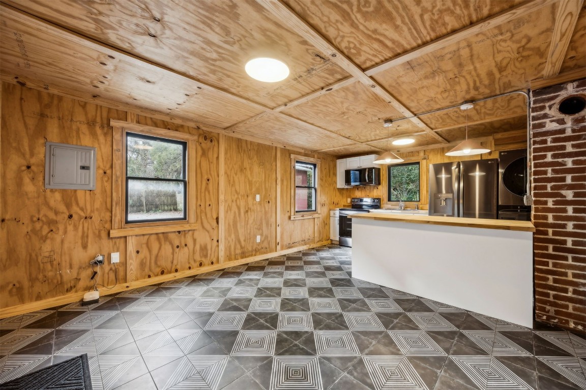 113 South 8th Street Fernandina Beach, FL 32034 - Photo 6 of 34 a view of a porch with wooden floor and windows