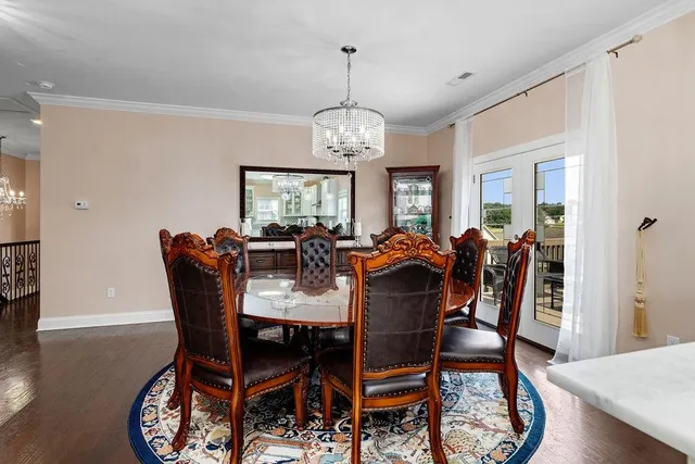 a kitchen with stainless steel appliances granite countertop a sink and dishwasher a stove with wooden floor