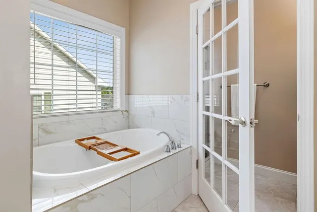 a bathroom with a shower and a glass door