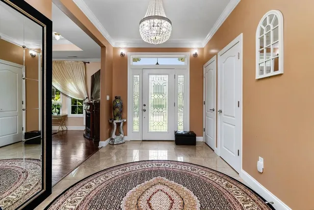 a view of an entryway with wooden floor