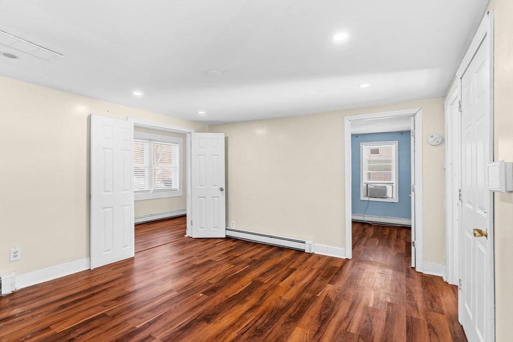192 East Spring Street Avon, MA 02322 - Photo 16 of 25 a view of empty room with wooden floor