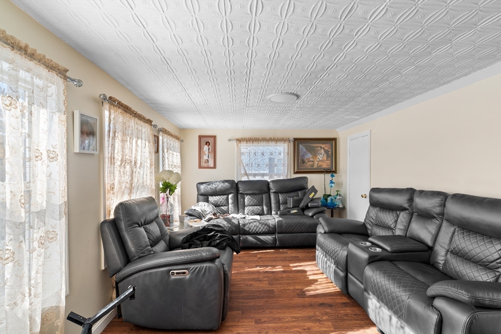 192 East Spring Street Avon, MA 02322 - Photo 18 of 25 a living room with furniture and a large window