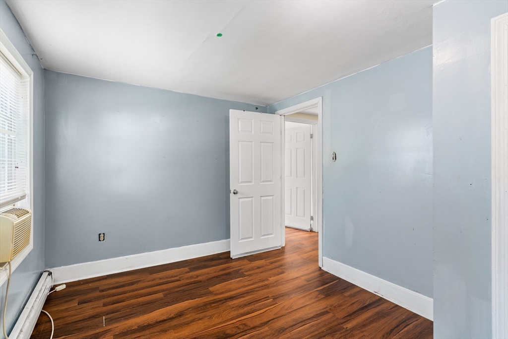 192 East Spring Street Avon, MA 02322 - Photo 8 of 25 a view of room with wooden floor and window