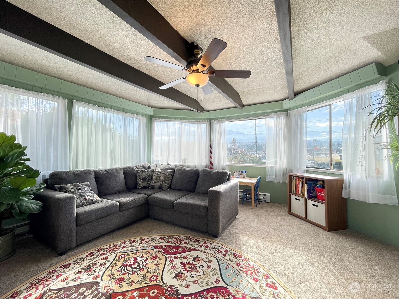 131 East 2nd Street Port Angeles, WA 98362 - Photo 12 of 33 a living room with furniture fireplace and a large window