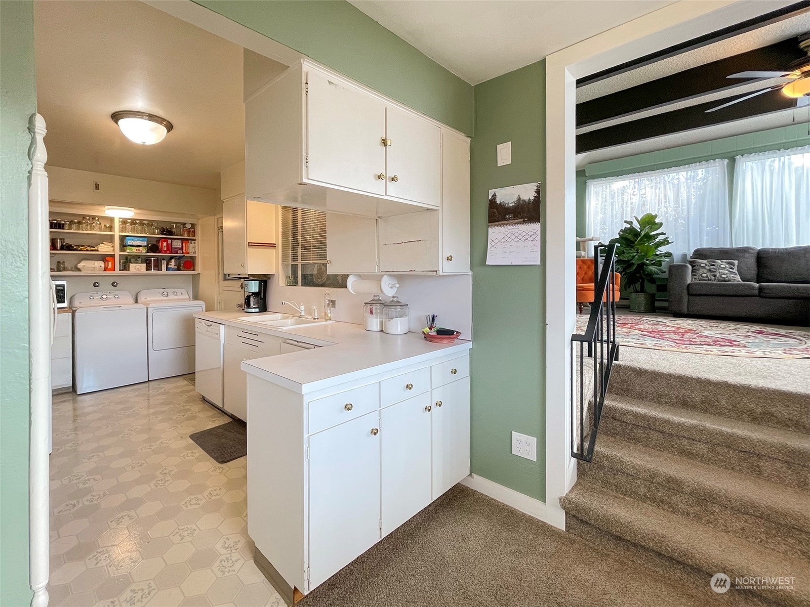 131 East 2nd Street Port Angeles, WA 98362 - Photo 17 of 33 a kitchen with white cabinets and white appliances