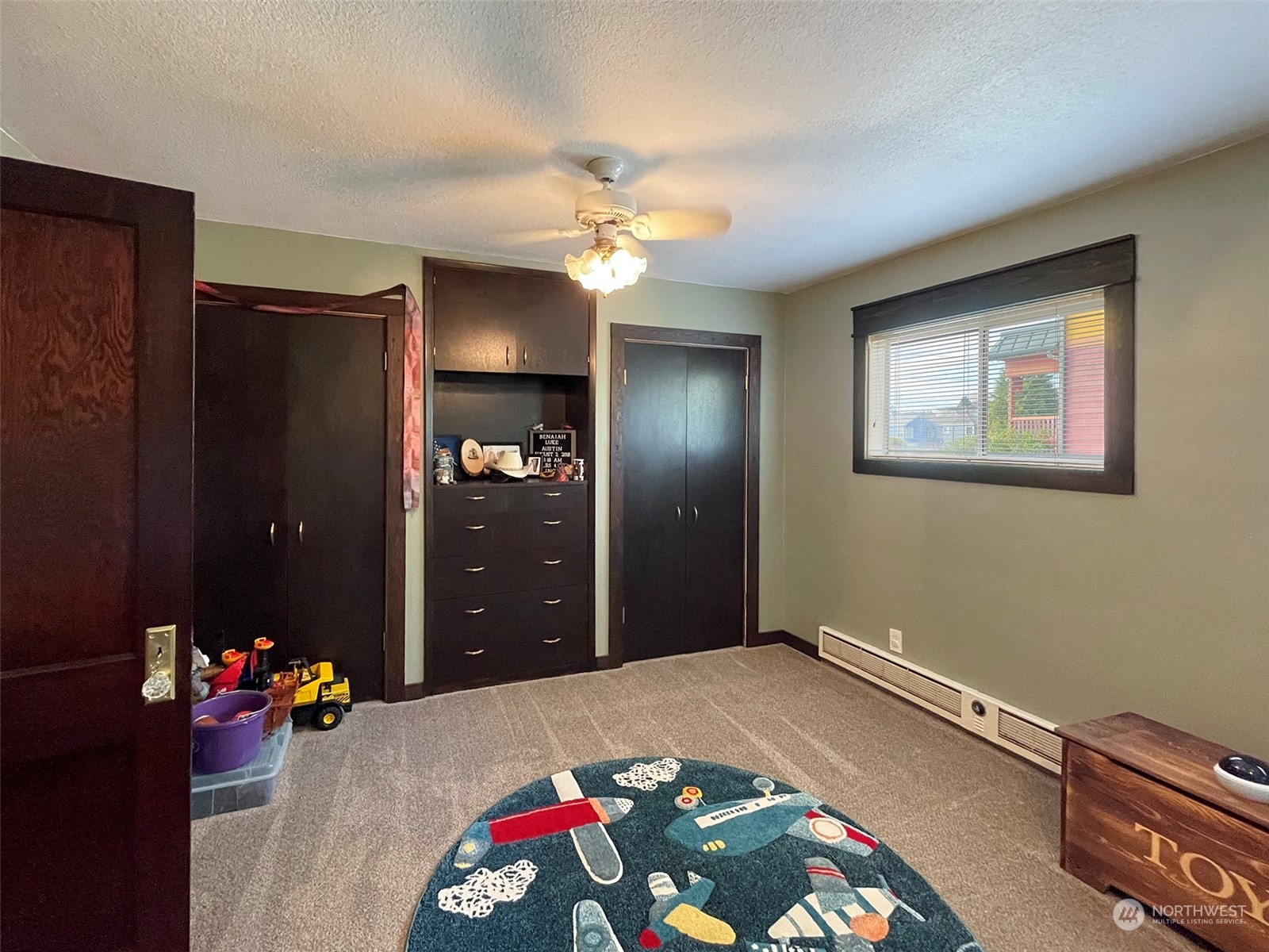 131 East 2nd Street Port Angeles, WA 98362 - Photo 20 of 33 a bedroom with a bed and a chandelier