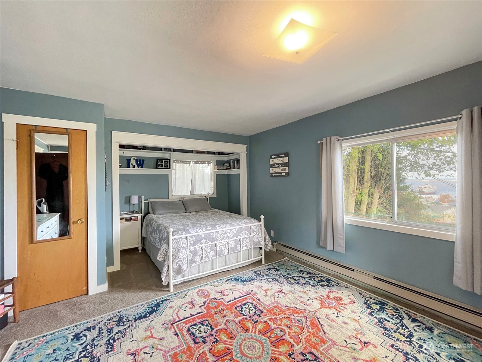 131 East 2nd Street Port Angeles, WA 98362 - Photo 24 of 33 a bedroom with a bed and a window