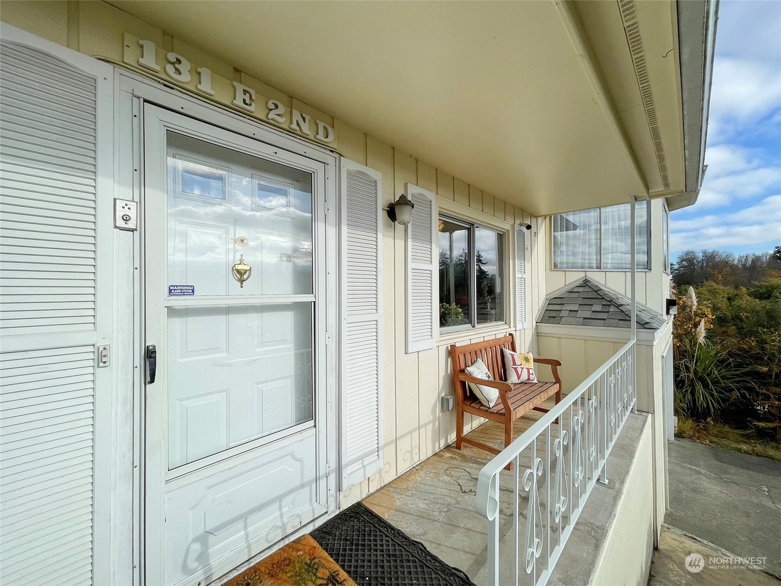 131 East 2nd Street Port Angeles, WA 98362 - Photo 5 of 33 a view of a hallway to a livingroom with furniture and floor to ceiling window