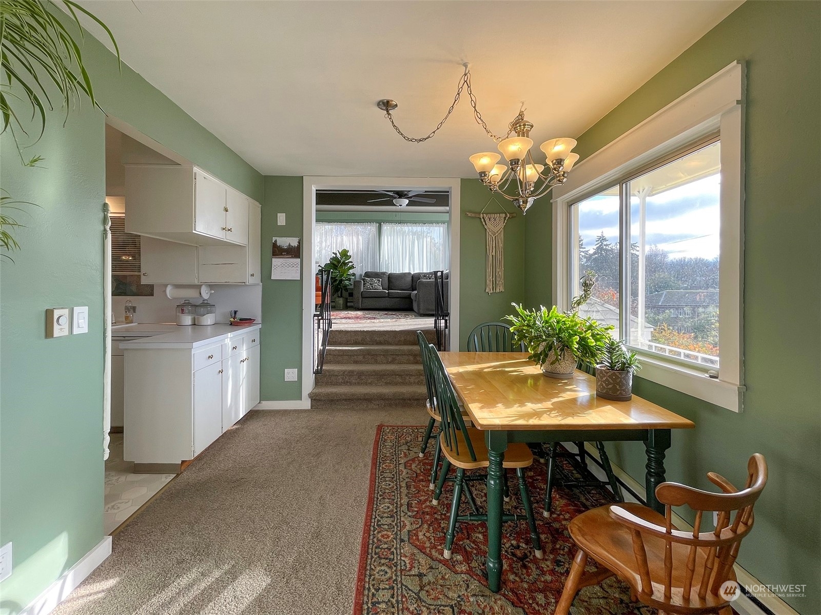131 East 2nd Street Port Angeles, WA 98362 - Photo 9 of 33 a view of a dining room with furniture and a chandelier