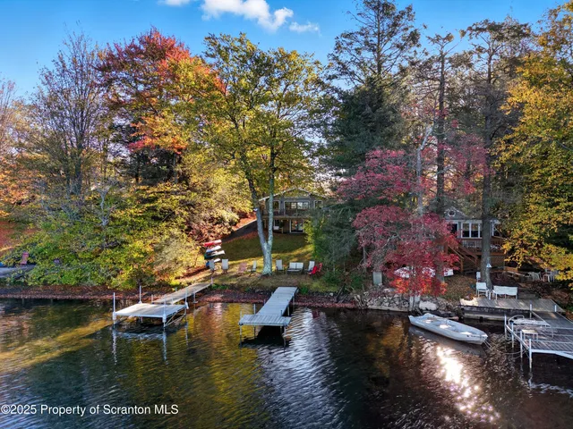a bathroom with a glass door shower