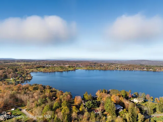 a bedroom with a bed and dresser