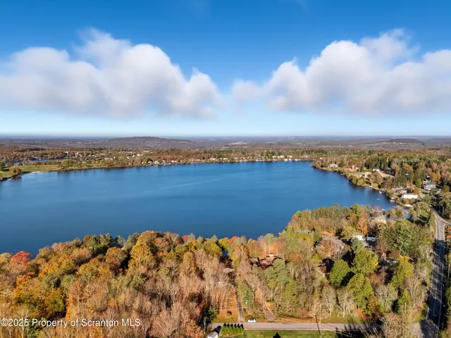 a living room with furniture a rug and a projector