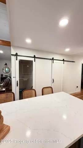 a bathroom with a sink toilet and mirror