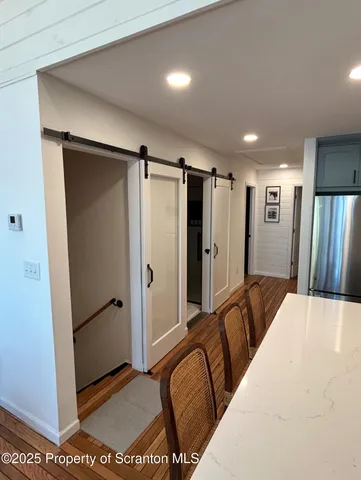 a living room with a couch and a floor to ceiling window